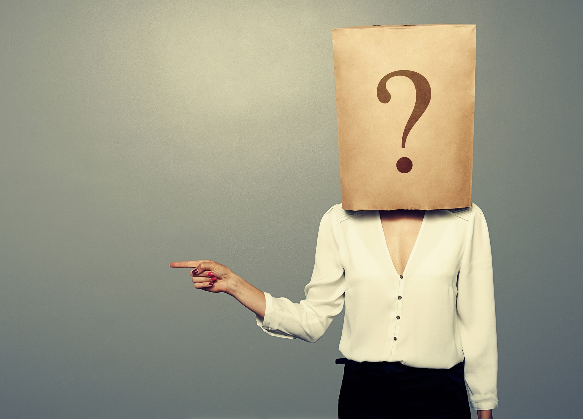 Woman With Paper Bag Pointing