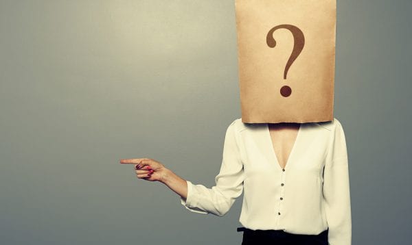 Woman With Paper Bag Pointing
