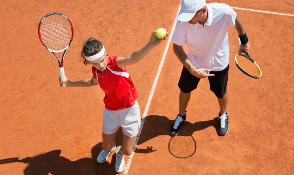 Practicing Tennis Service