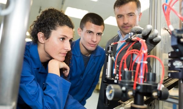 Boss Showing Workers A New Machine